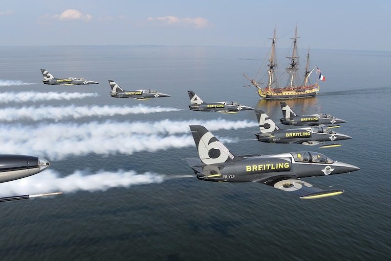Six L-39C aircraft of the Brietling Jet Team pass over the replica of the 18th-century French ship Hermione, the ship that brought Marquis de Lafayette to the United States in 1780, as the ship sails up the Patuxent River to visit Annapolis, Md.,June 13, 2015. The Brietling Jet Team are currently on their first tour of the USA and the Hermione is on its first visit to port along the East Coast after having sailed from France. (Photo © 2015 Greg L. Davis/Breitling Jet Team) Six L-39C aircraft of the Brietling Jet Team pass over the replica of the 18th-century French ship Hermione, the ship that brought Marquis de Lafayette to the United States in 1780, as the ship sails up the Patuxent River to visit Annapolis, Md.,June 13, 2015. The Brietling Jet Team are currently on their first tour of the USA and the Hermione is on its first visit to port along the East Coast after having sailed from France. (Photo © 2015 Greg L. Davis/Breitling Jet Team)